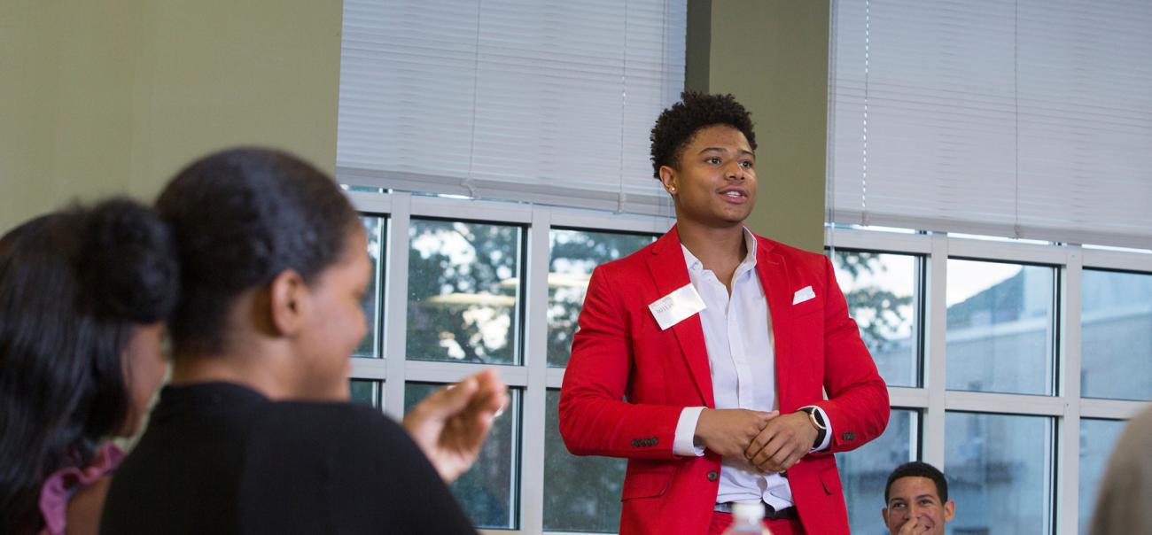 College of Business students talk during a conference