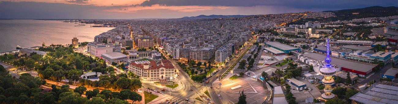 A stock image with an aerial view of Thessaloniki, Greece at twilight.