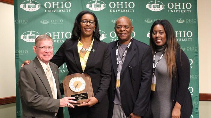 MSA Alumni pose with an award