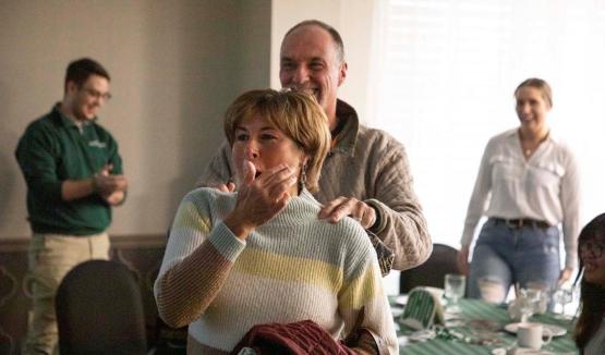 Tim and Tammy Reynolds surprised by a room full of alumni and friends