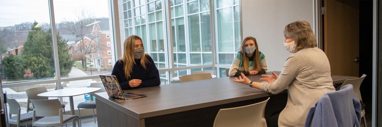 From left, Hannah Boesger, Emily Marino and Dr. Jennifer Hines