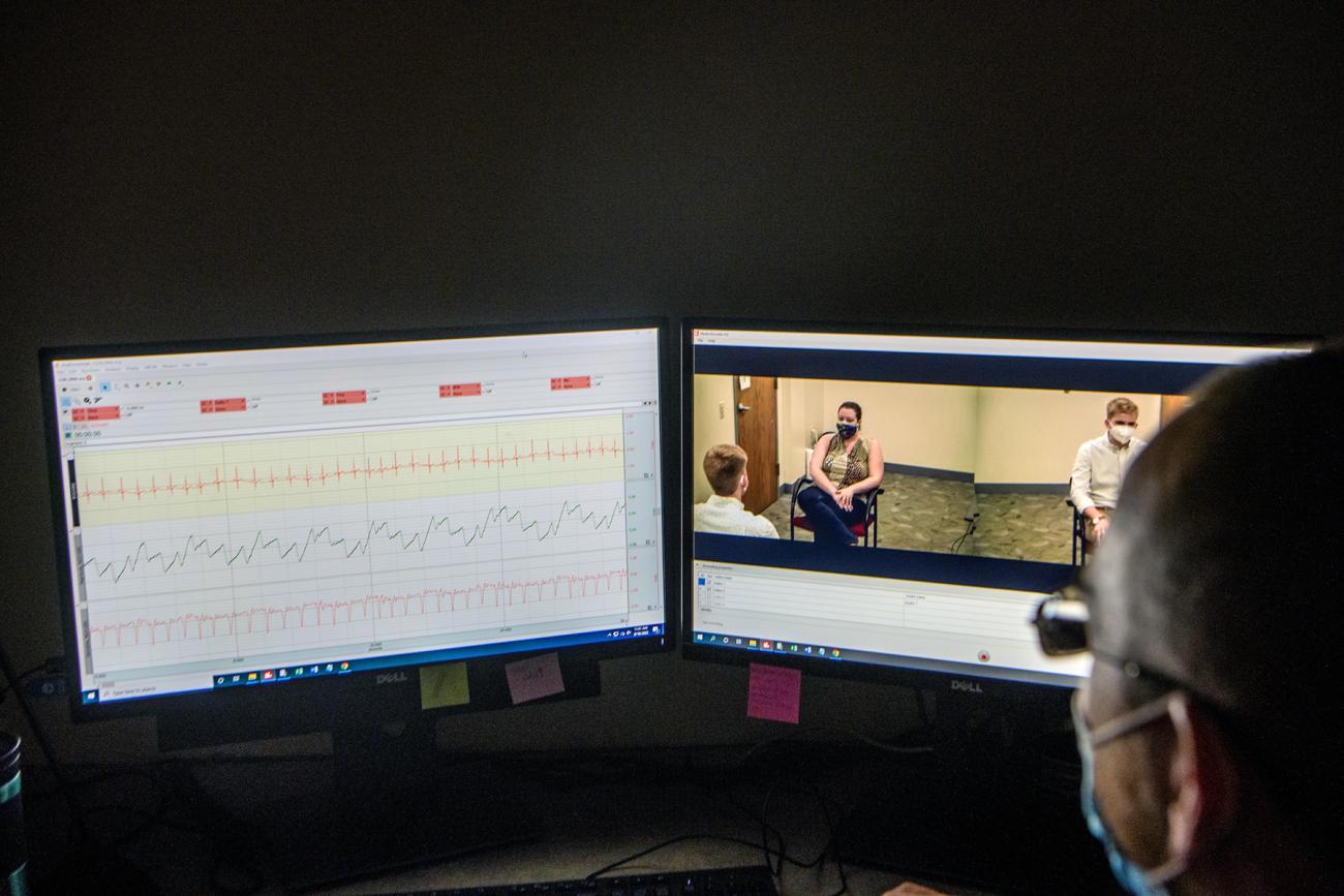 Psychologist looking at polygraph test