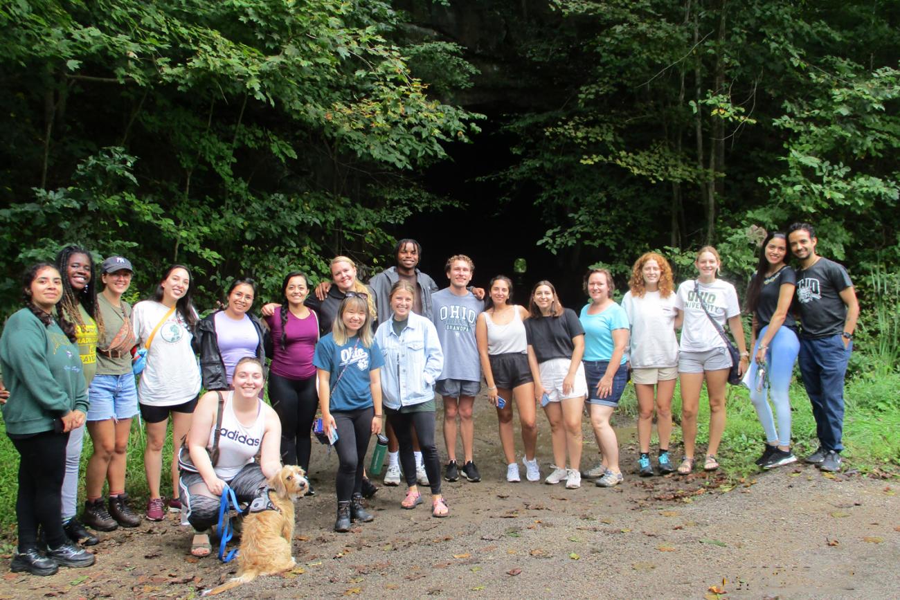 Spanish Graduate students 2023, group photo with service dog
