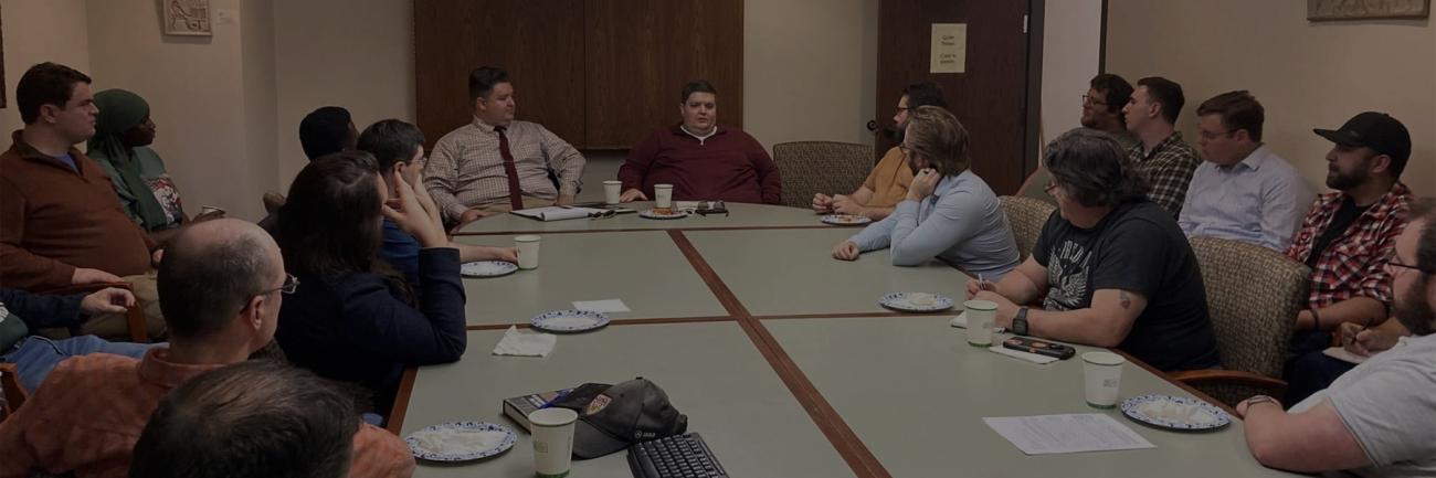 History alumni Seth and Adam Givens talk with graduate students
