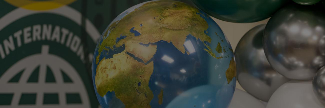 A globe and balloons celebrating international connections at OHIO 
