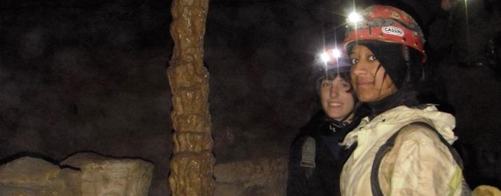 Graduate students surveying a West Virginia cave