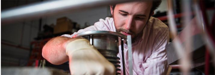 Undergraduate student Jared Ray works in the accelerator lab.