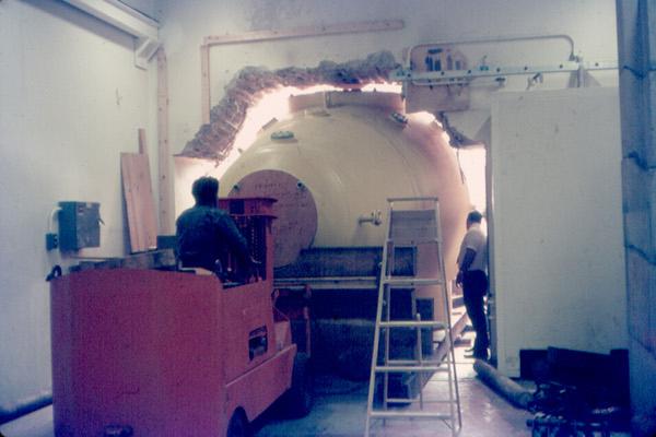 It was necessary to break away some of the brand new concrete in order to fit the tank into the building.