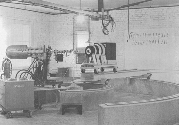 The original Radiation Lab was equipped with a 150-kV Cockroft-Walton accelerator manufactured by the Texas Nuclear Corporation. This laboratory was housed in the old Dailey garage on Richland Avenue near where the new 682 bypass is now located. This photo is taken from the proposal submitted to the U.S. Atomic Energy Commission to fund the tandem accelerator.