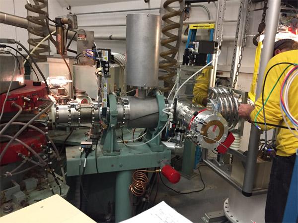 Accelerator Engineer Devon Jacobs with the Alphatross in October 2019, following installation. The first plasma was achieved the following week. Photo by Don Carter.