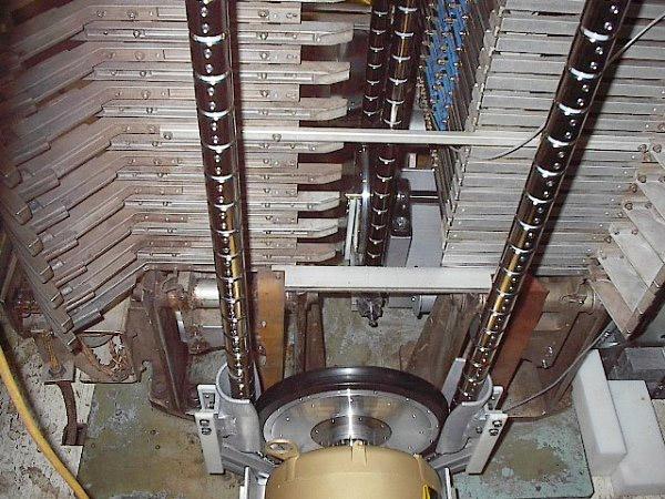 Some of the installed chains and pulleys on January 17, 2012. Our system utilizes three chains, running vertically. The Pelletron charging system was sucessfully tested at 1 MV terminal voltage on January 24, 2012, and at 4 MV a few days later. Photo by Devon Jacobs.