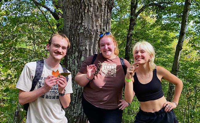 Plant Cub officers posing in the woods