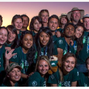 A group of global health students at sunset