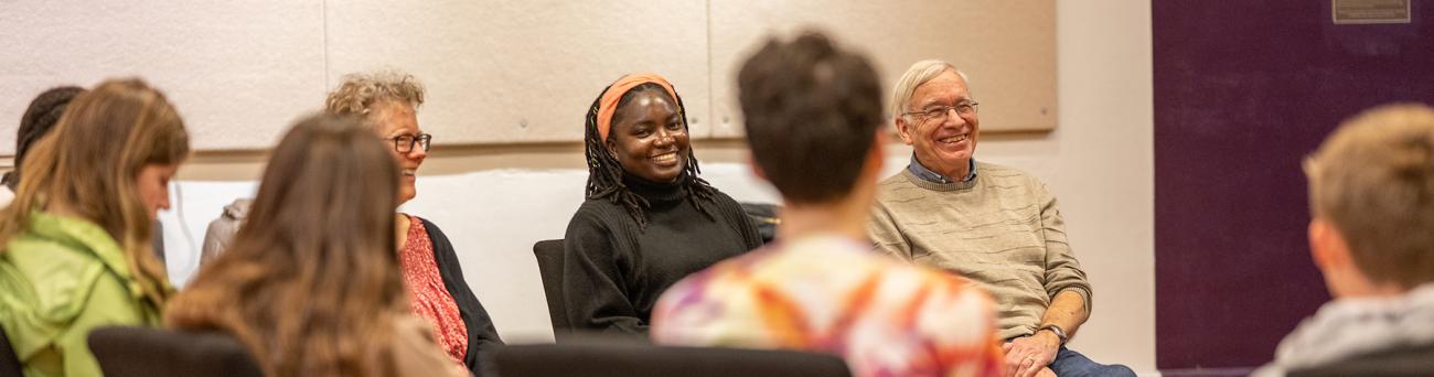 Individuals have a discussion during a workshop.