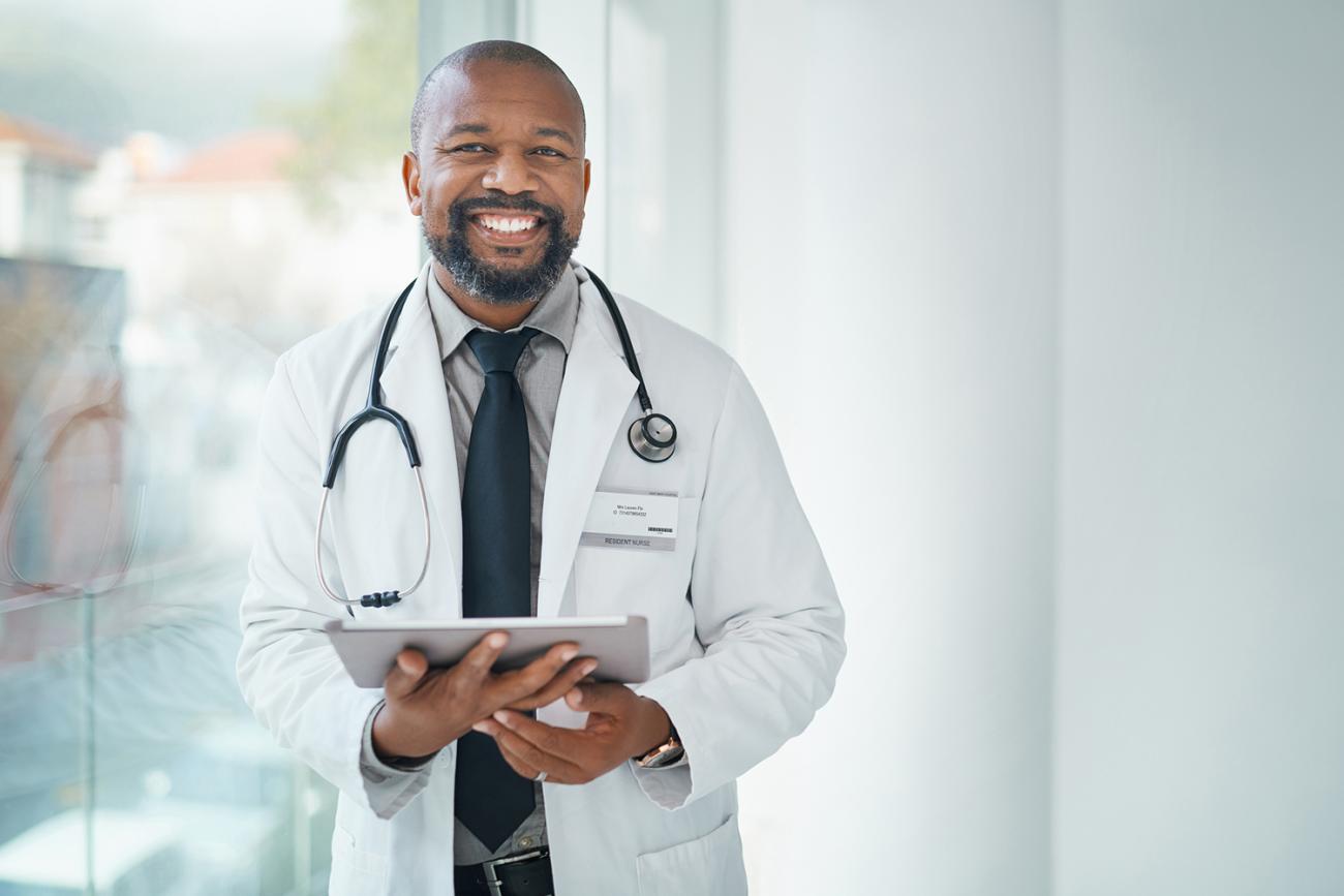 Male Family Nurse Practitioner holding a chart