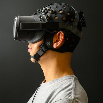 A patient wears goggles and sensors on their head.