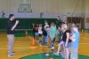 gym teacher speaking with children