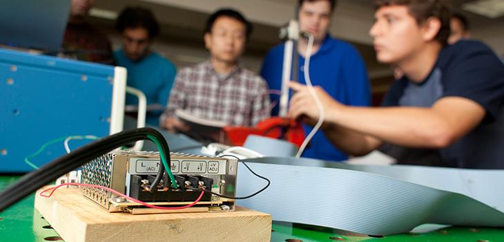 Students using research equipment.