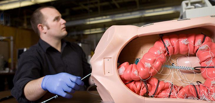 A person using a biomedical dummy