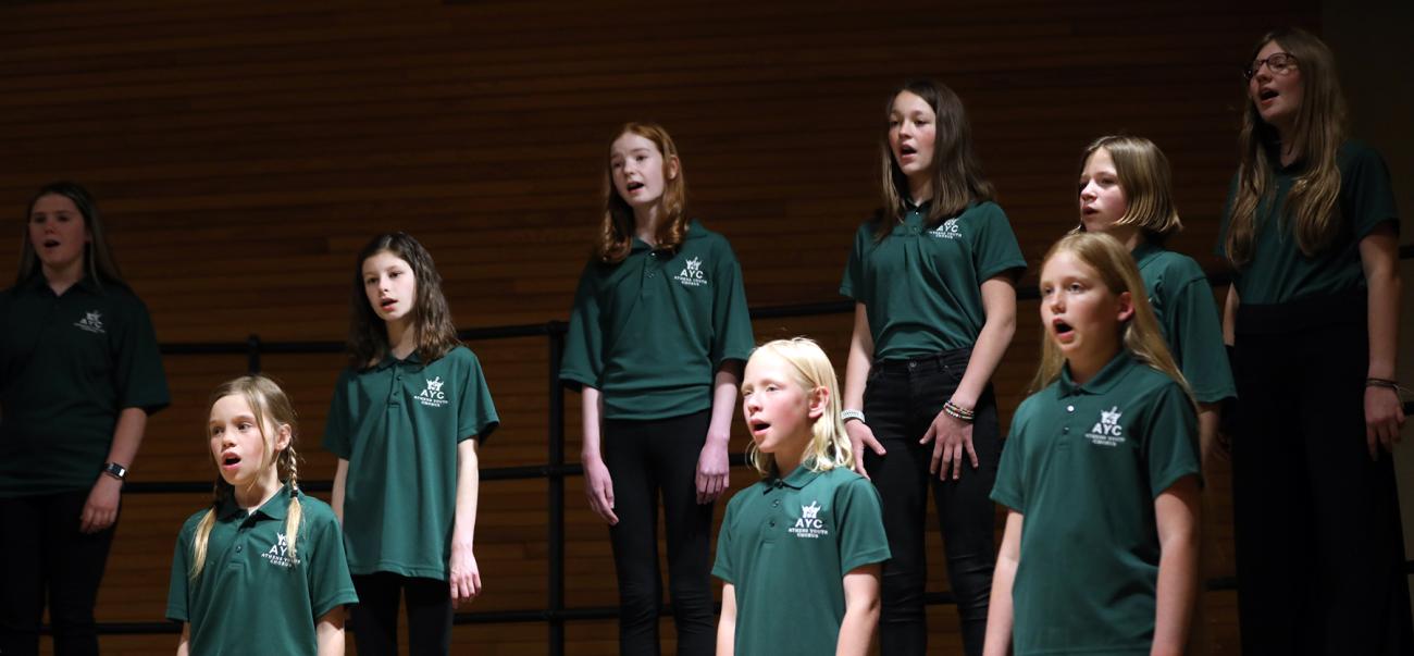 people on a stage singing