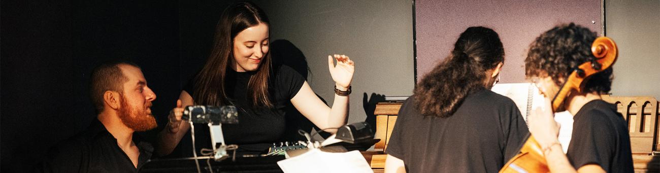 Students play music during a performance.