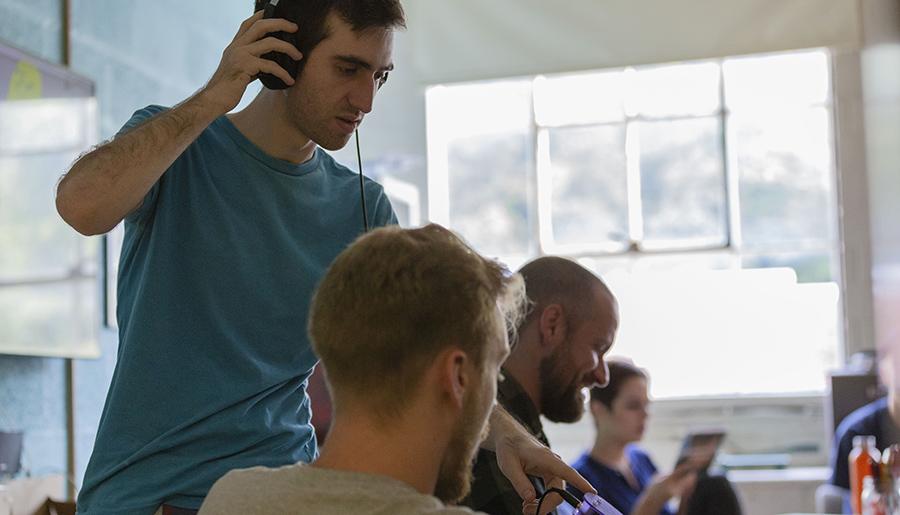 Film student with headphones in class