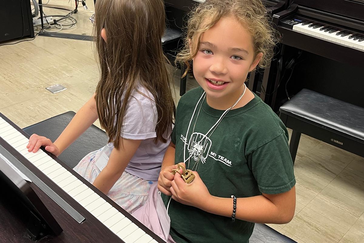 student at piano