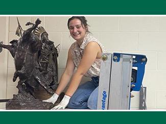 Student working on a sculpture