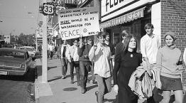 Historic black and white photo of students protesting the Vietnam War on Court Street, Athens Ohio