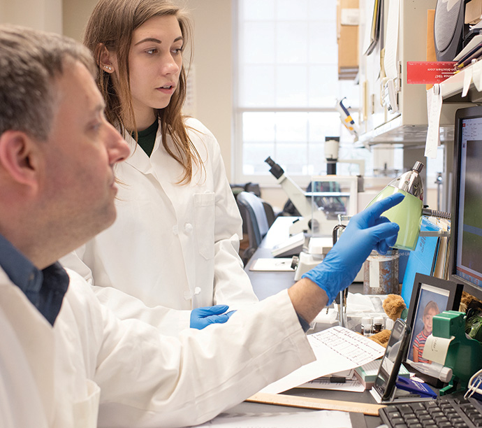 Two people work together in a lab