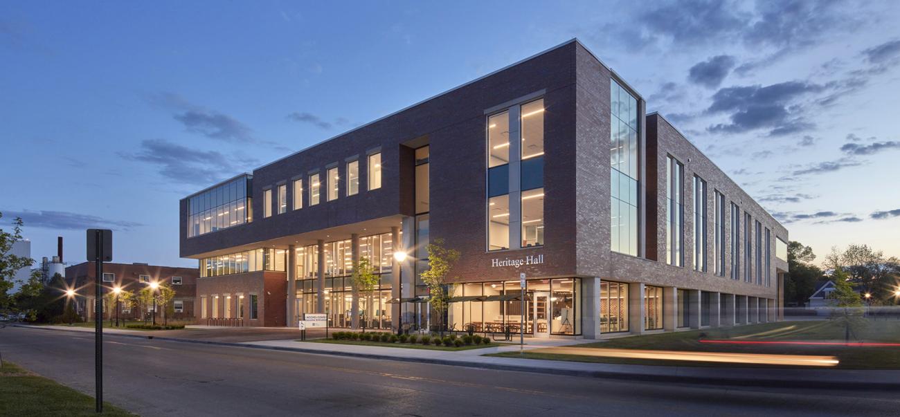 Heritage Hall exterior at dusk with lights on inside