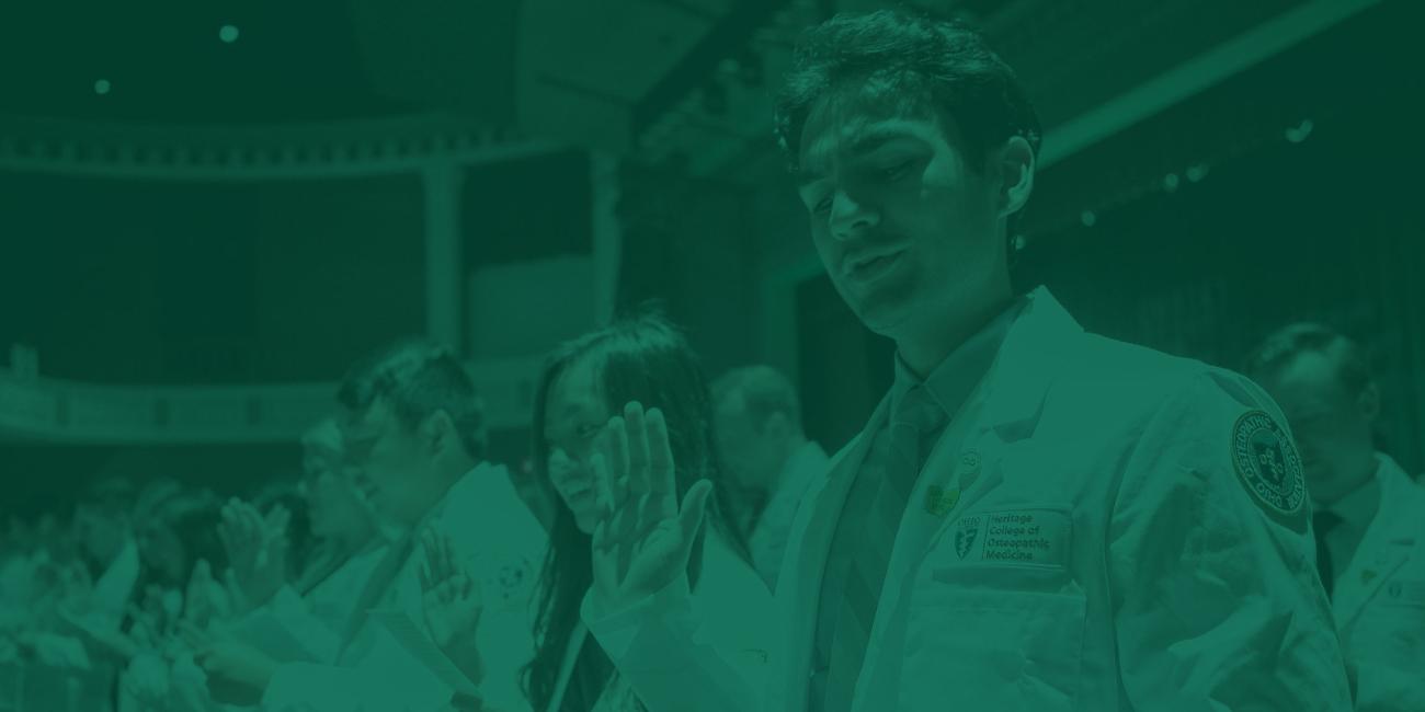 Medical students recite the Hippocratic Oath during their White Coat ceremony