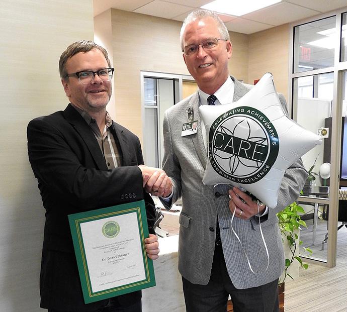 Dan Skinner receives CARE award