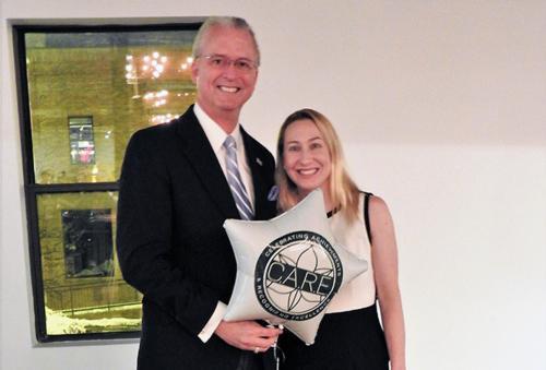 Andrea Brunson receiving award
