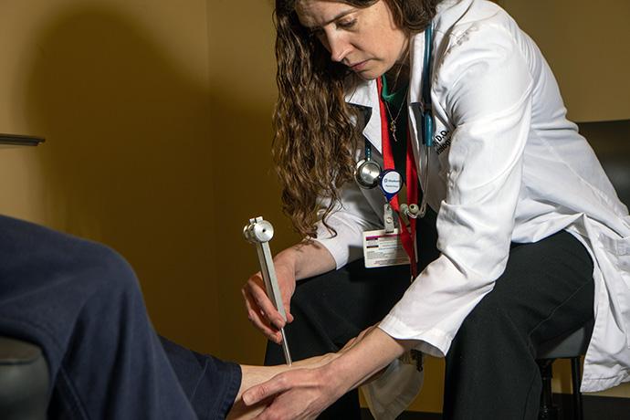 Dr. Amber Healy completing a foot exam on diabetes patient.
