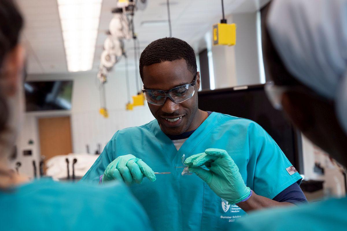 student preparing to suture
