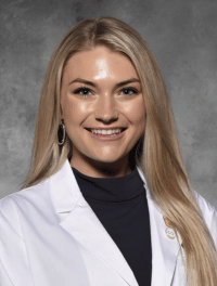 Head shot of Ashley Fischer in white coat