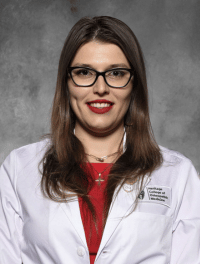 head shot of Elena-Loredana Rotariu in white coat