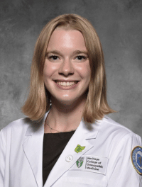 head shot of Riley Bunstine in white coat