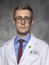 head shot of Victor Rogers in white coat