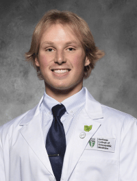 head shot of Gary in white coat