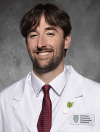 head shot of Jacob in white coat