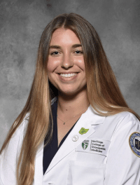 Head shot of Lauren in white coat