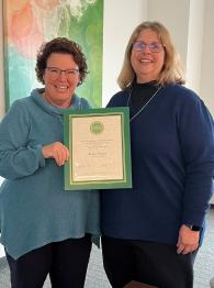 Athens HCOM Dean Tracy Shaub (left) presents CARE Award to Becky Vinson