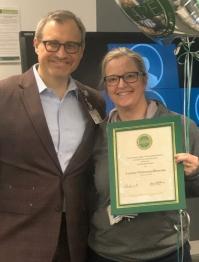 Cleveland HCOM Dean Isaac Kirstein (left) presents CARE Award to Leanne Chrisman-Khawam