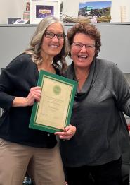 Athens HCOM Dean Shaub (right) presents CARE Award to Dawn Mollica