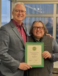 Dublin HCOM Dean Burke (left) presents CARE Award to Terry Porter