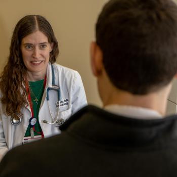 Dr. Healy talks to patient