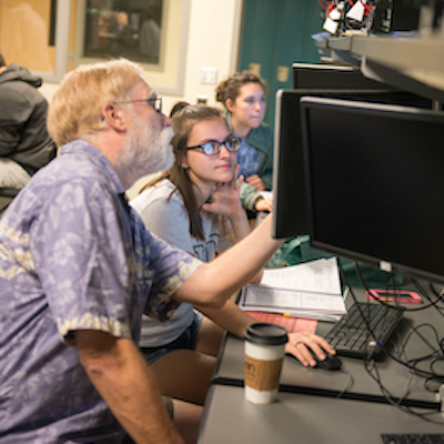 Professor and students learning.