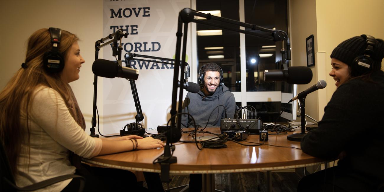 Students in podcast studio